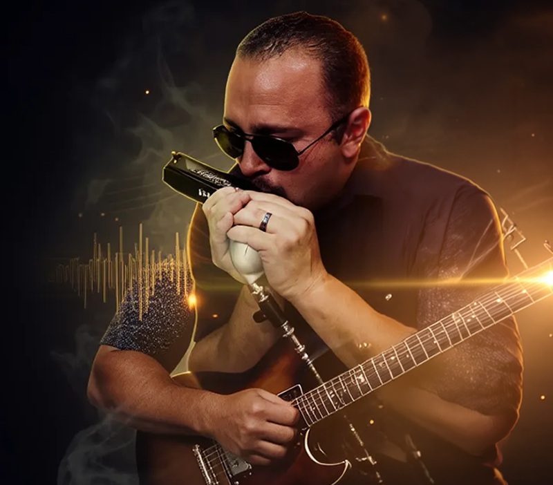 Stevie B playing the mouth organ